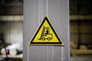 forklift safety sign on a poll