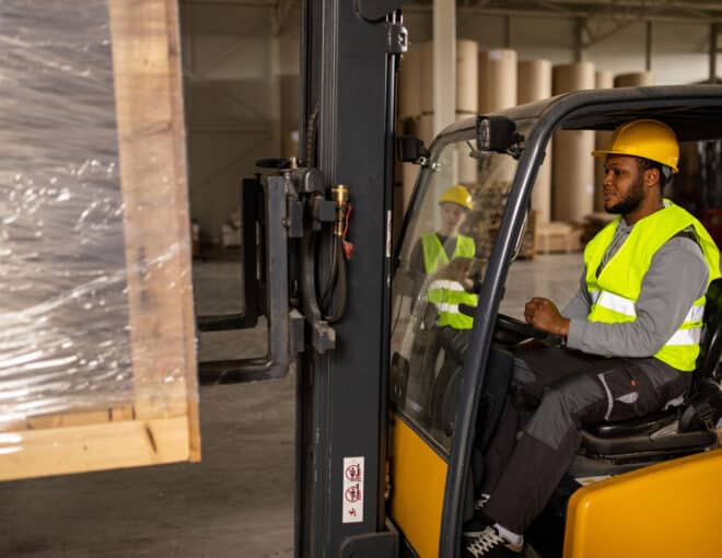 warehouse worker in a forklift