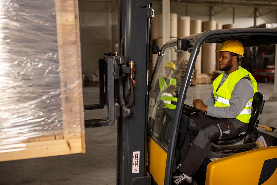 warehouse worker in a forklift