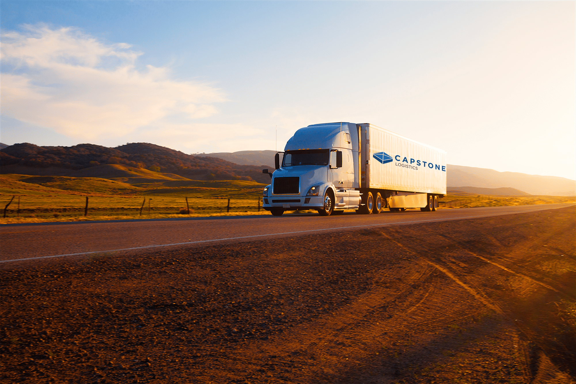 3PL capstone truck driving down empty roadway