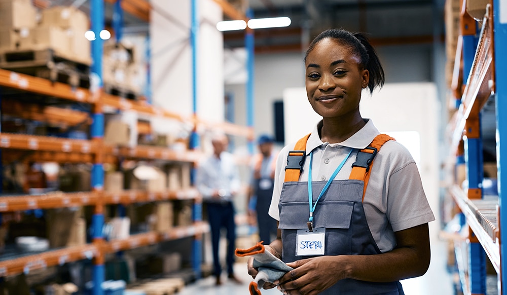 smiling worker inside a warehouse