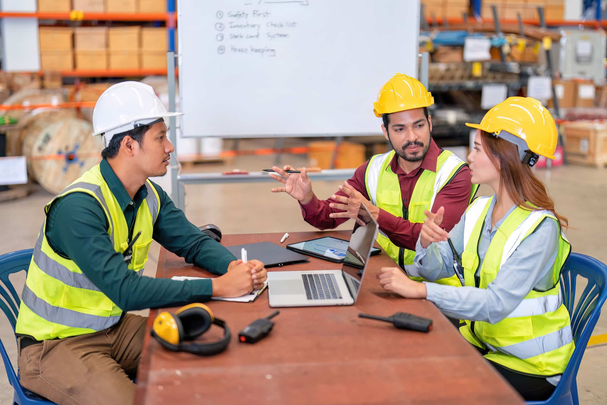 warehouse workers sitting for a meeting inside the warehouse