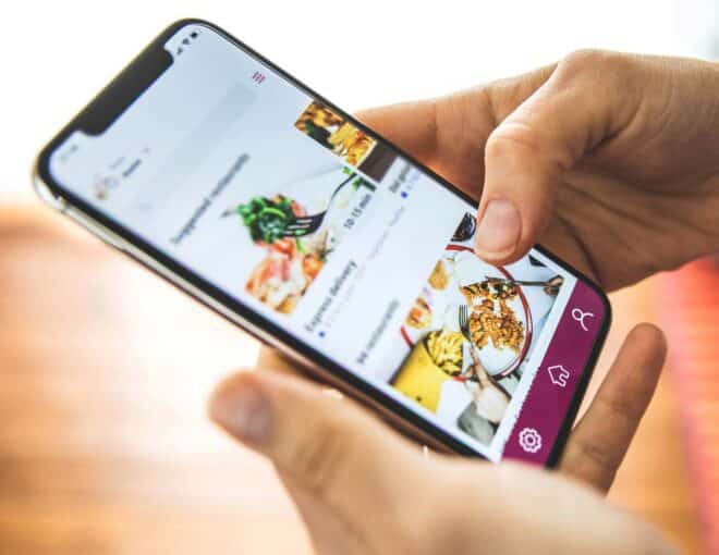 user selecting food delivery on smartphone