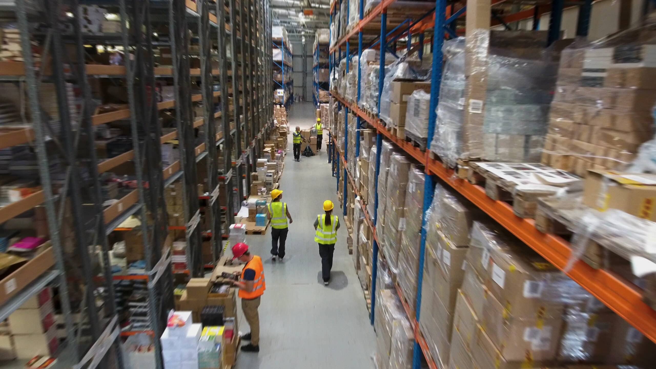 team inside warehouse checking inventory