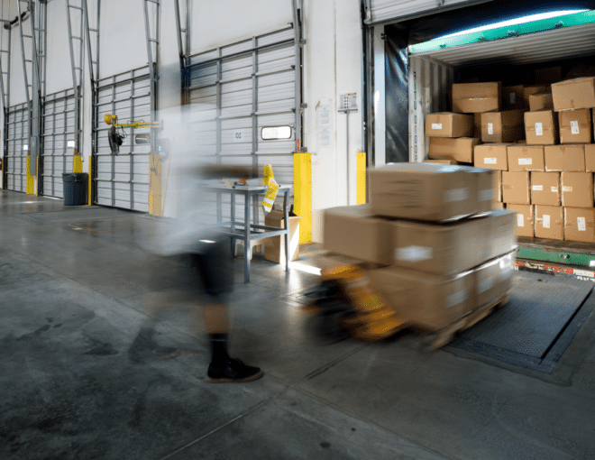 boxes being loaded into truck at loading dock