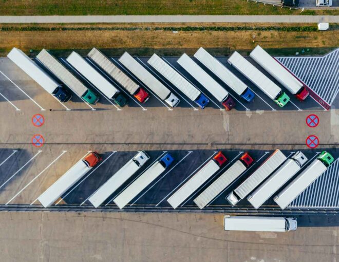 semi trucks parked in lot