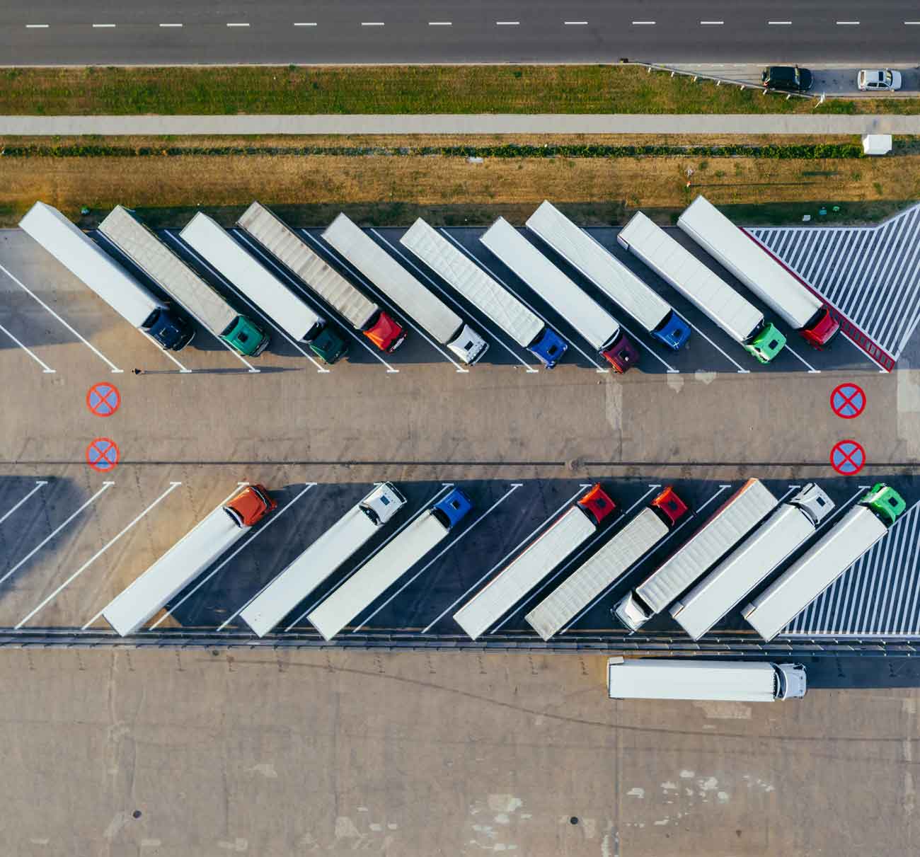 semi trucks parked in lot