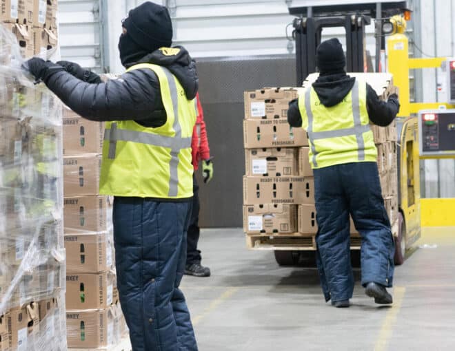 Capstone employees working in food warehouse