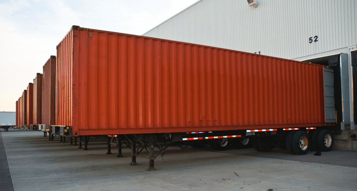 shipping containers at loading dock