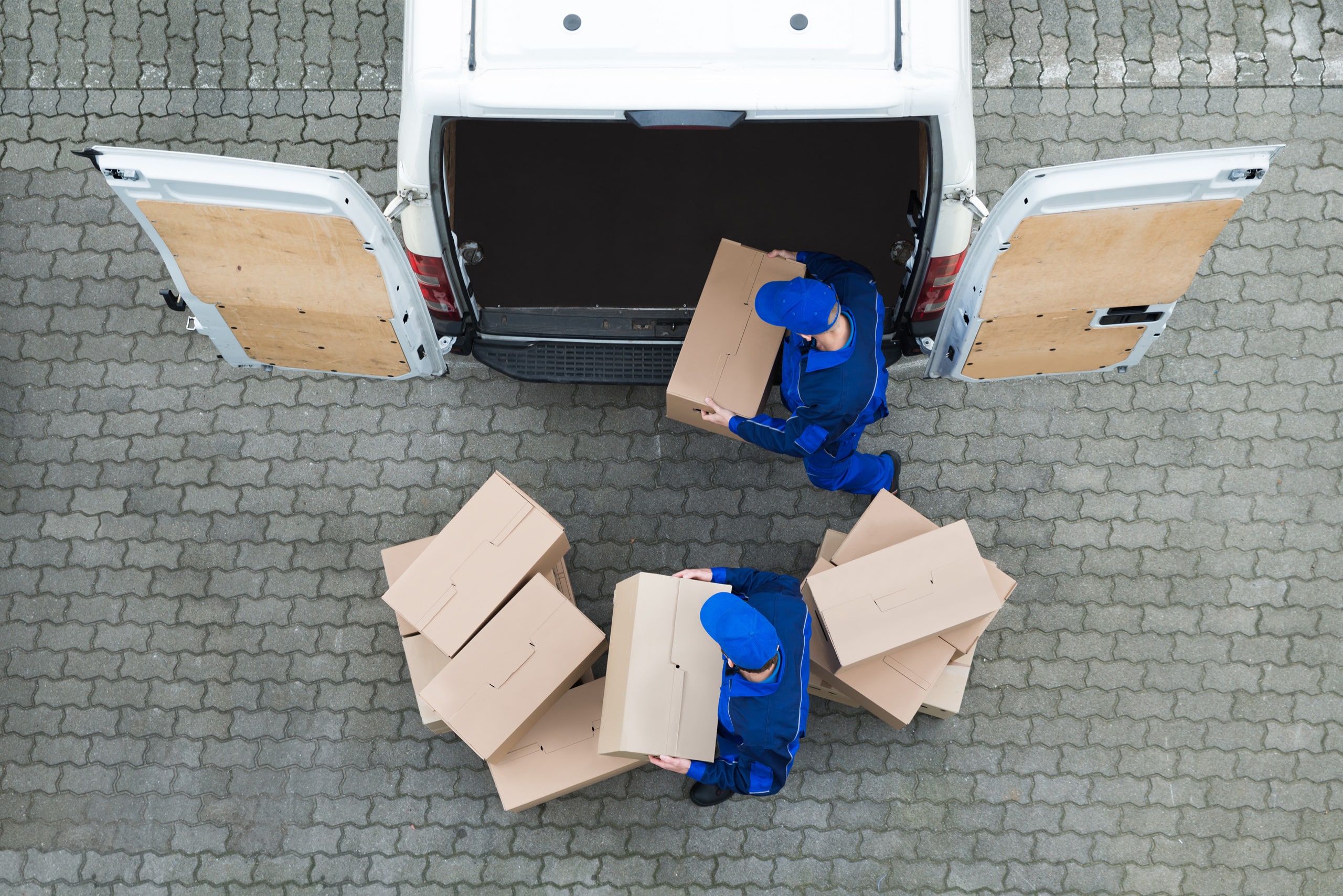 workers unloading boxes from truck