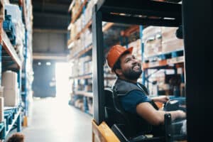 Male Forklift Smiling with the Capstone Pay for Performance Model