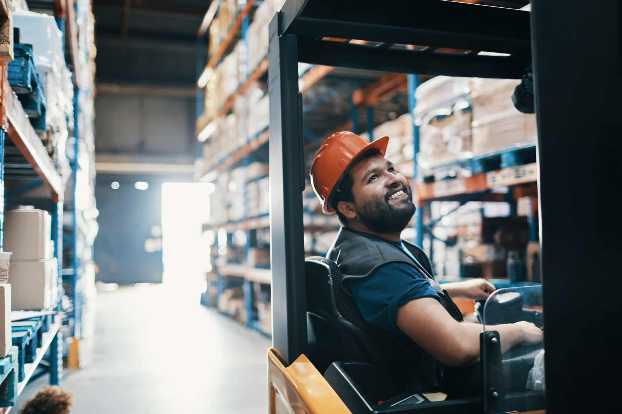 Male Forklift Smiling with the Capstone Pay for Performance Model