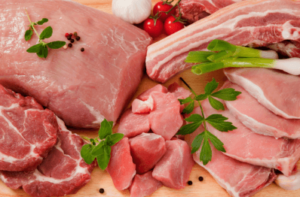 raw meat of different types on a cutting board