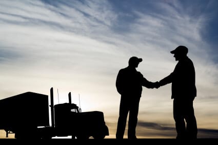 two drivers shaking hands