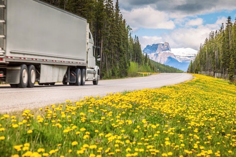 truck driving on scenic road