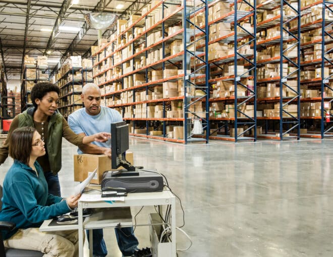 Warehouse workers checking inventory