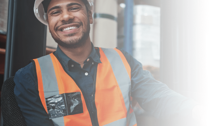 smiling worker on forklift