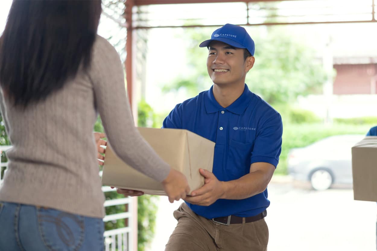Capstone Logistics Last / Final Mile Driver Delivering Package