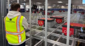 capstone employee overlooking automation line