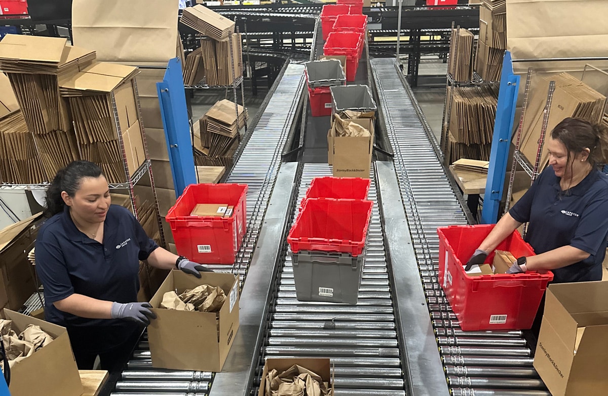 Capstone employees loading boxes and containers