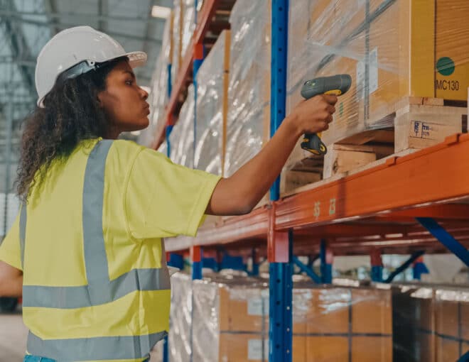 warehouse worker scanning pallets