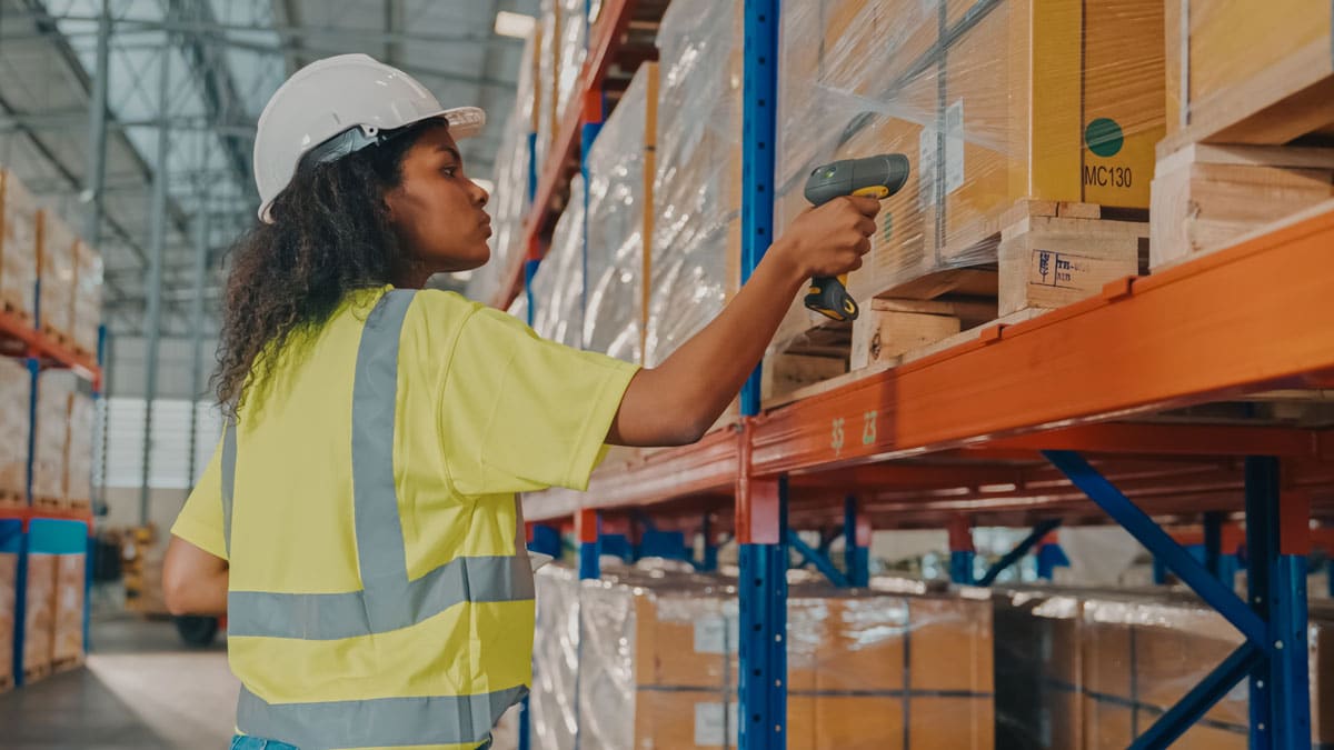 warehouse worker scanning pallets