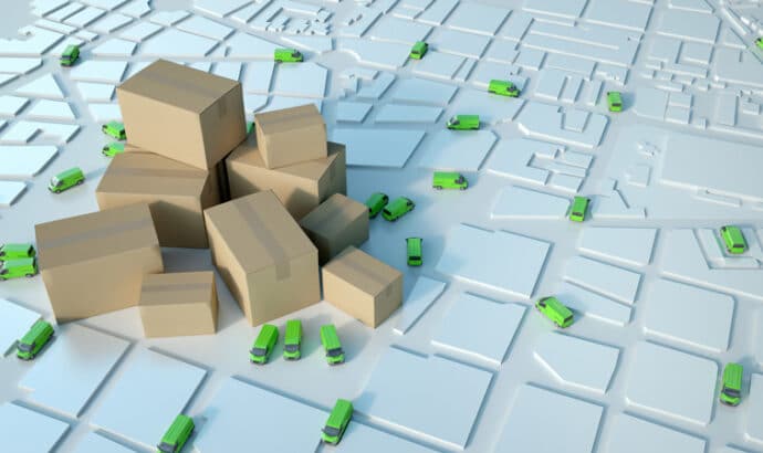Last-mile delivery concept with packages and green vans