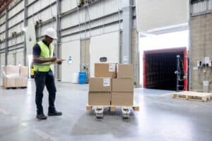 warehouse worker taking notes in a dock