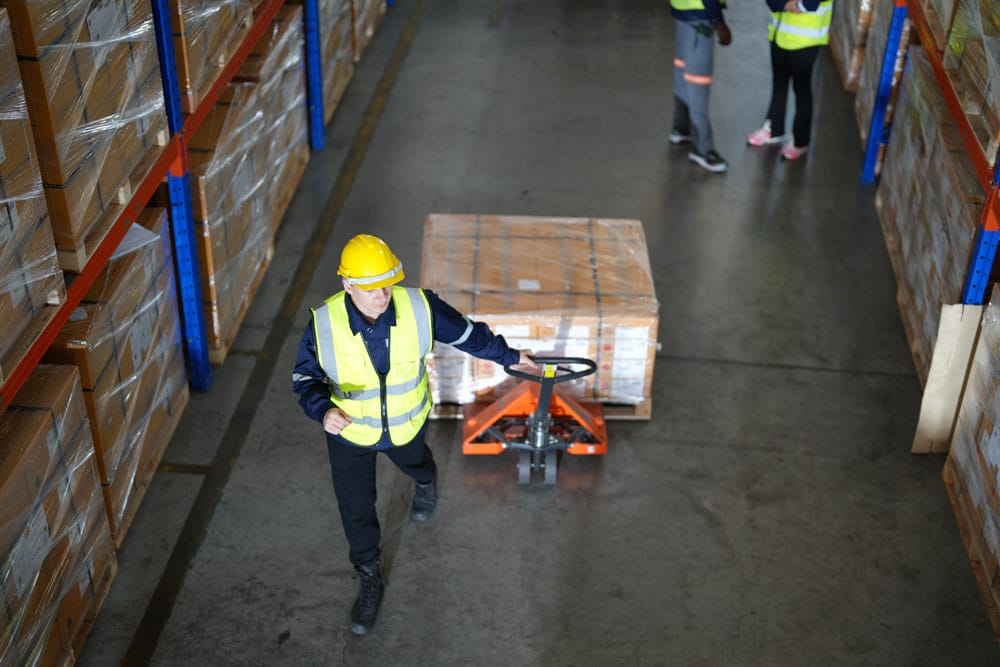 warehouse worker unloading in a distribution center
