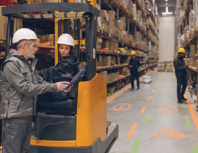 Warehouse staff handling operations in a busy distribution center