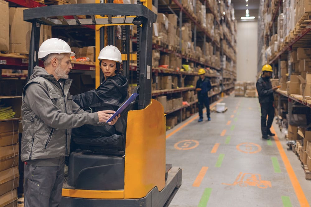 Warehouse staff handling operations in a busy distribution center