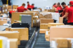 warehouse associates on a kitting line
