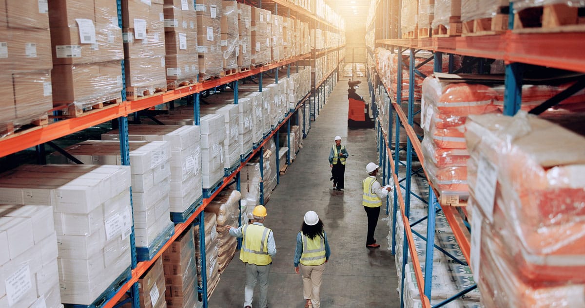 Warehouse associates working across a distribution center.